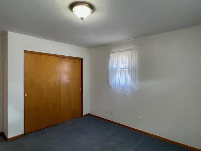 512 Tana Ln, Joliet, IL 60435 - unfurnished bedroom featuring a closet and carpet
