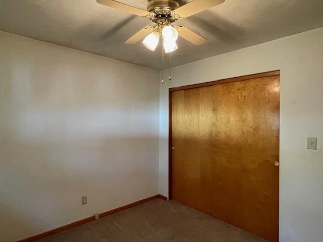 512 Tana Ln, Joliet, IL 60435 - unfurnished bedroom featuring carpet, a closet, and a ceiling fan