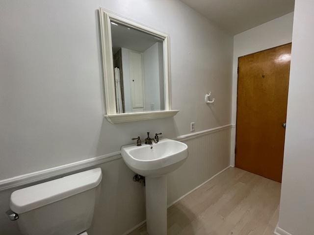 512 Tana Ln, Joliet, IL 60435 - half bath with wood finished floors and a wainscoted wall