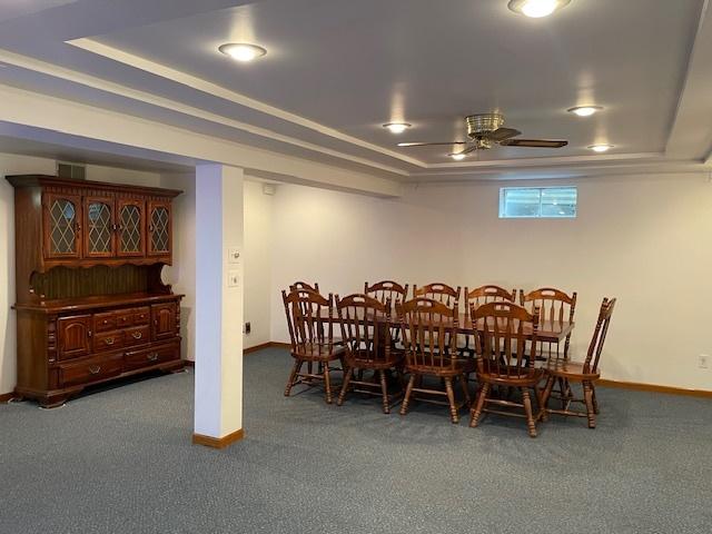 512 Tana Ln, Joliet, IL 60435 - dining area with a raised ceiling, carpet floors, and a ceiling fan