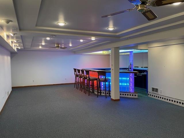 512 Tana Ln, Joliet, IL 60435 - bar with a ceiling fan and carpet