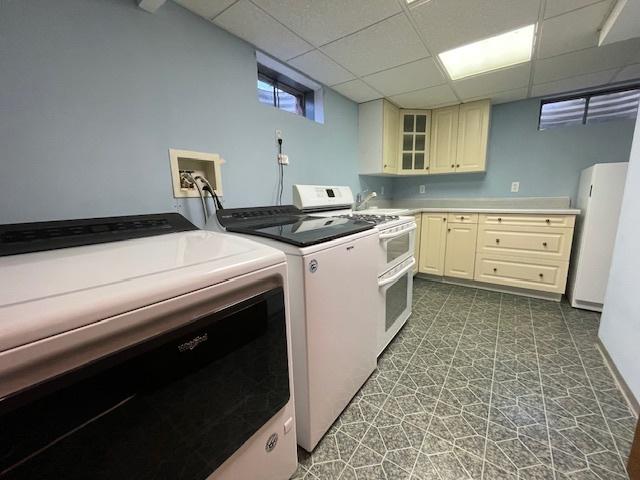 512 Tana Ln, Joliet, IL 60435 - laundry room featuring tile patterned floors and separate washer and dryer