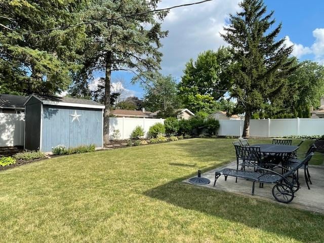 512 Tana Ln, Joliet, IL 60435 - fenced backyard featuring a shed and a patio