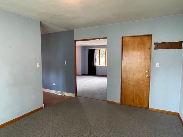 512 Tana Ln, Joliet, IL 60435 - spare room with carpet floors and baseboards