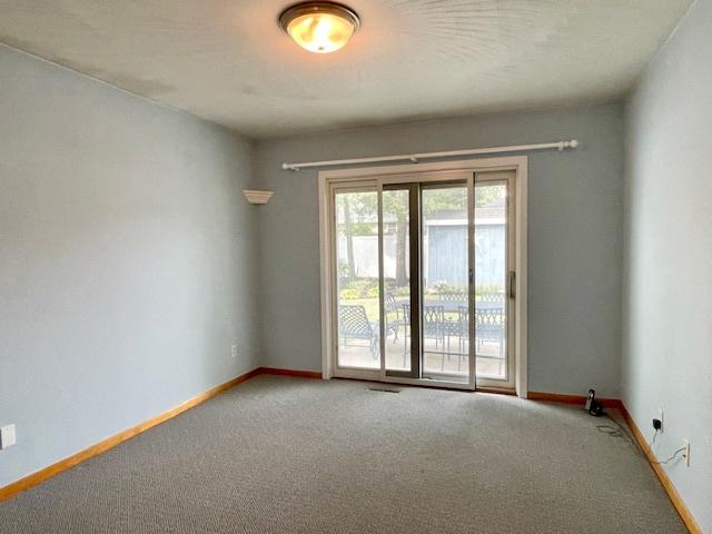 512 Tana Ln, Joliet, IL 60435 - unfurnished room featuring carpet and baseboards