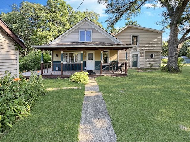 725 Opal St, Marseilles, IL 61341 - rear view of property featuring a yard and covered porch