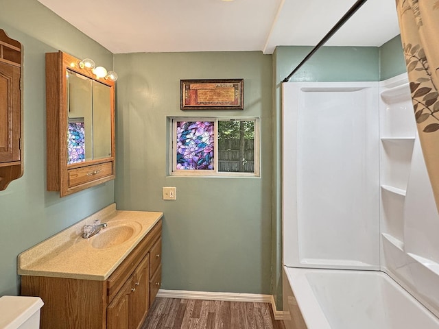 725 Opal St, Marseilles, IL 61341 - bathroom with wood finished floors, vanity, and  shower combination