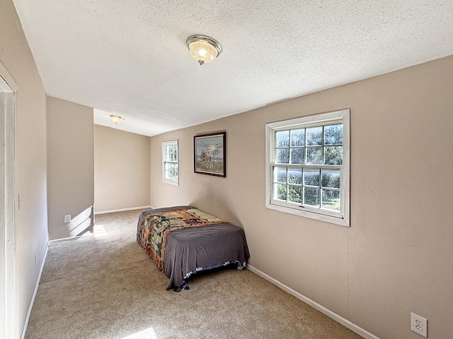 725 Opal St, Marseilles, IL 61341 - carpeted bedroom with baseboards and a textured ceiling