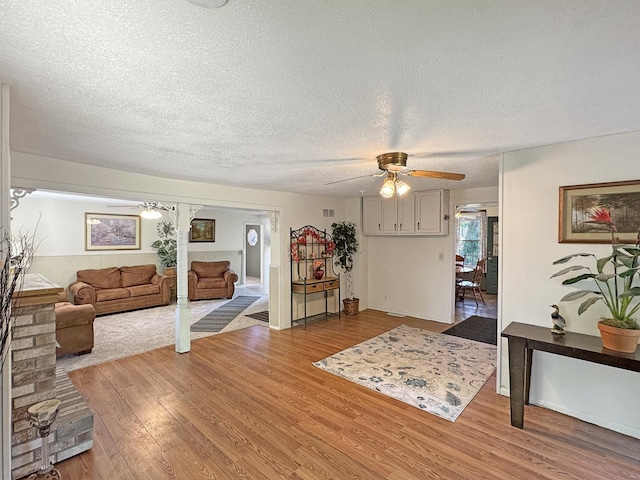 725 Opal St, Marseilles, IL 61341 - living area with a ceiling fan, light wood-style flooring, and a textured ceiling