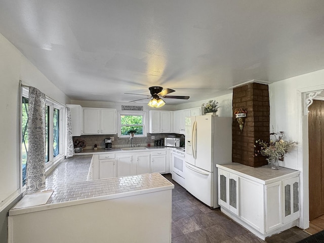 725 Opal St, Marseilles, IL 61341 - kitchen featuring white appliances, white cabinets, a ceiling fan, light countertops, and backsplash