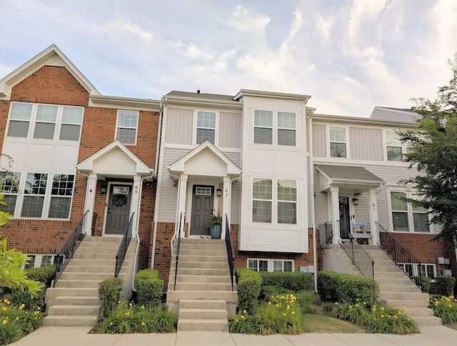 63 Nicholas Dr W, Des Plaines, IL 60016 - view of front of home with stairs, board and batten siding, and brick siding