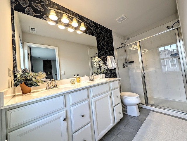 63 Nicholas Dr W, Des Plaines, IL 60016 - bathroom with tile patterned floors, double vanity, and a shower stall