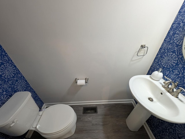 63 Nicholas Dr W, Des Plaines, IL 60016 - bathroom featuring wallpapered walls and wood finished floors