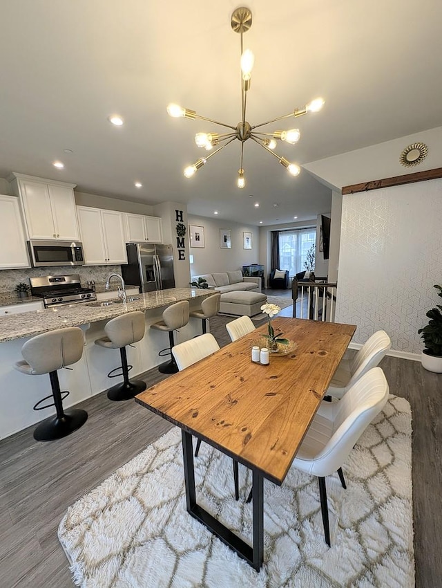 63 Nicholas Dr W, Des Plaines, IL 60016 - dining room featuring wood finished floors, a chandelier, and recessed lighting