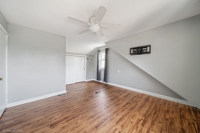 15 Ridge Rd, Lemont, IL 60439 - spare room featuring ceiling fan, wood finished floors, and vaulted ceiling