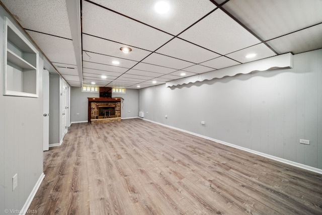 15 Ridge Rd, Lemont, IL 60439 - finished below grade area with wood finished floors, a brick fireplace, a paneled ceiling, and recessed lighting