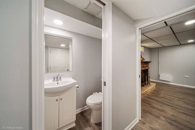 15 Ridge Rd, Lemont, IL 60439 - bathroom with vanity, wood finished floors, recessed lighting, and a fireplace