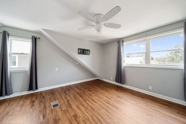 15 Ridge Rd, Lemont, IL 60439 - spare room featuring wood finished floors, a ceiling fan, and vaulted ceiling
