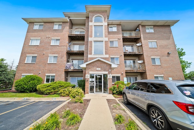 941 N Swift Rd Unit 201, Addison, IL 60101 - view of apartment building / complex with uncovered parking
