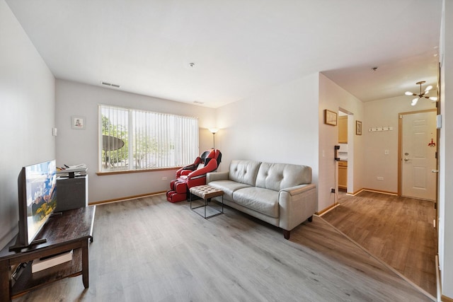 941 N Swift Rd Unit 201, Addison, IL 60101 - living area with wood finished floors and a chandelier