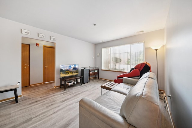 941 N Swift Rd Unit 201, Addison, IL 60101 - living room featuring light wood-style flooring and baseboards