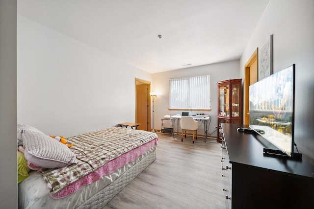 941 N Swift Rd Unit 201, Addison, IL 60101 - bedroom featuring wood finished floors and an office area