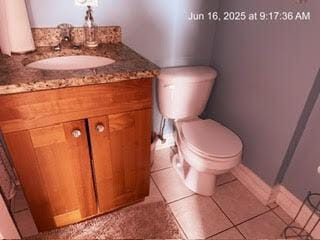 2651 E 74th St Unit 201, Chicago, IL 60649 - bathroom featuring vanity and tile patterned flooring