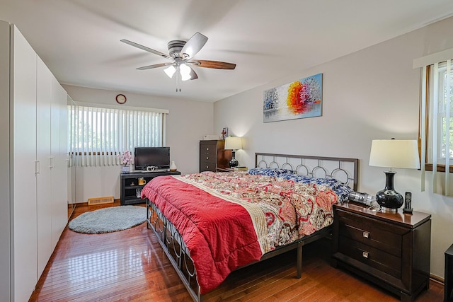 1008 S Beechwood Dr, Mount Prospect, IL 60056 - bedroom featuring multiple windows, hardwood / wood-style flooring, and ceiling fan