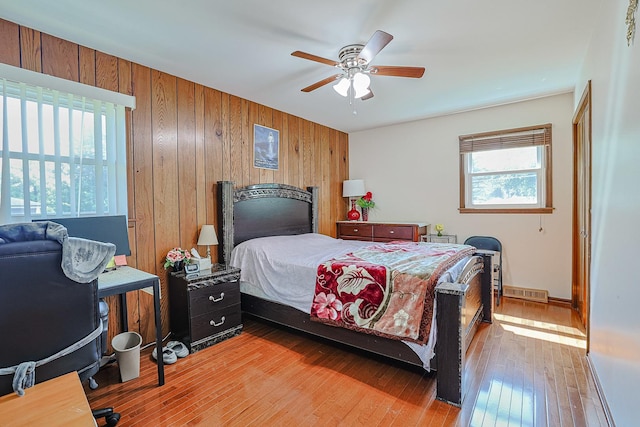 1008 S Beechwood Dr, Mount Prospect, IL 60056 - bedroom with wooden walls, light wood finished floors, and ceiling fan