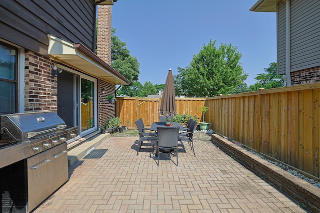 1008 S Beechwood Dr, Mount Prospect, IL 60056 - fenced backyard with outdoor dining space, a patio area, and area for grilling