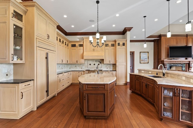 23 Enclave Ct, South Barrington, IL 60010 - kitchen with a spacious island, paneled fridge, crown molding, a chandelier, and dark wood finished floors