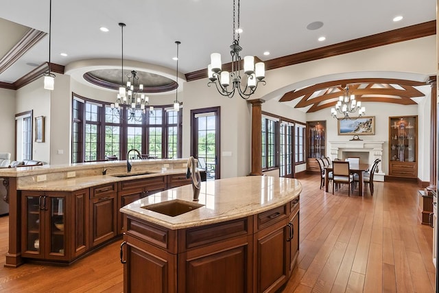23 Enclave Ct, South Barrington, IL 60010 - kitchen with a chandelier, open floor plan, a large island, crown molding, and light stone counters