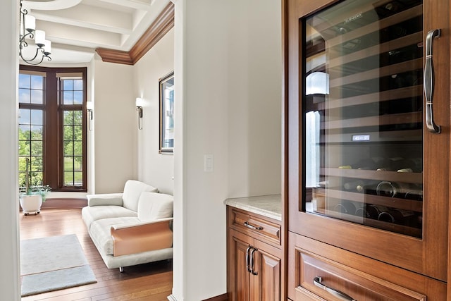 23 Enclave Ct, South Barrington, IL 60010 - bar area featuring beverage cooler, wood finished floors, crown molding, a chandelier, and beamed ceiling