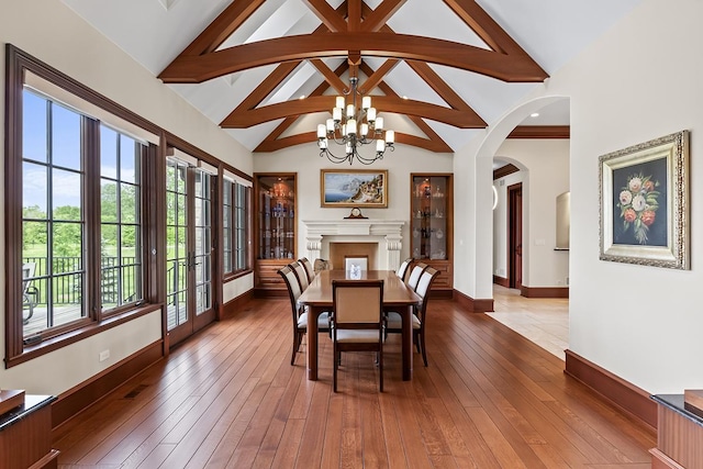 23 Enclave Ct, South Barrington, IL 60010 - dining space with a chandelier, arched walkways, hardwood / wood-style floors, beamed ceiling, and high vaulted ceiling