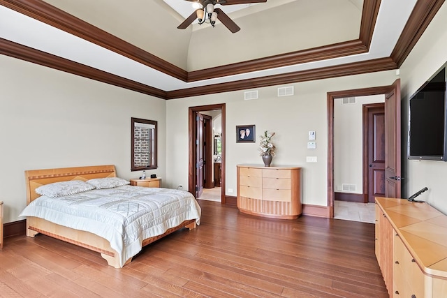 23 Enclave Ct, South Barrington, IL 60010 - bedroom featuring wood finished floors, crown molding, a ceiling fan, connected bathroom, and a tray ceiling