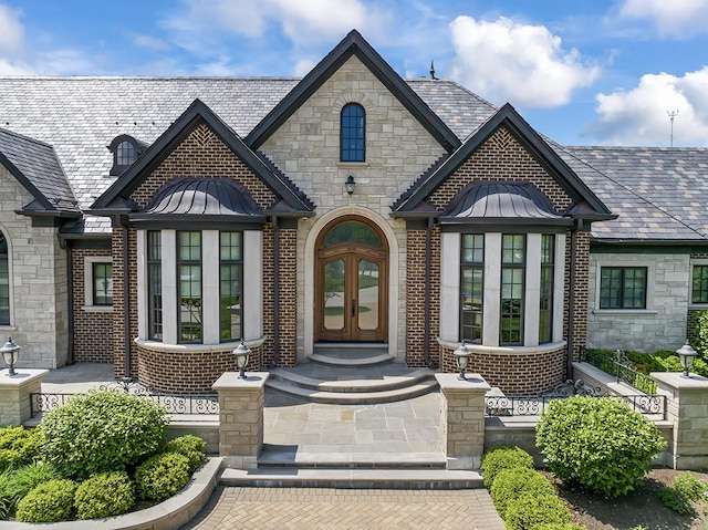 23 Enclave Ct, South Barrington, IL 60010 - view of front of property with a standing seam roof, a high end roof, and french doors