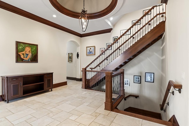23 Enclave Ct, South Barrington, IL 60010 - entryway with arched walkways, stone tile floors, ornamental molding, stairs, and recessed lighting