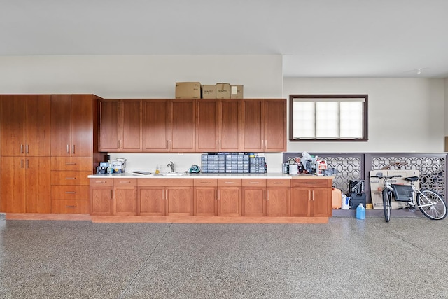 23 Enclave Ct, South Barrington, IL 60010 - kitchen featuring light countertops, speckled floor, and brown cabinetry