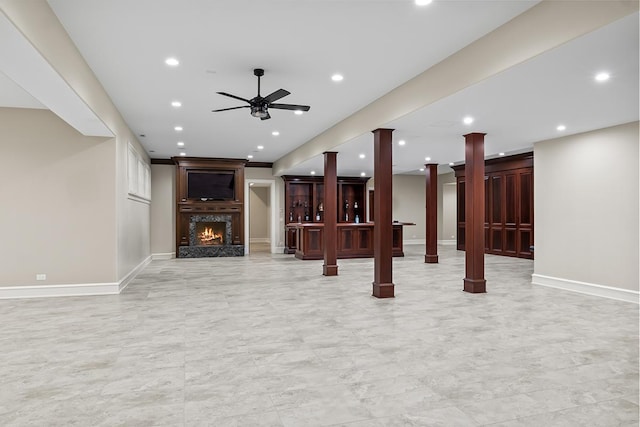 23 Enclave Ct, South Barrington, IL 60010 - unfurnished living room with a ceiling fan, recessed lighting, ornate columns, and a warm lit fireplace