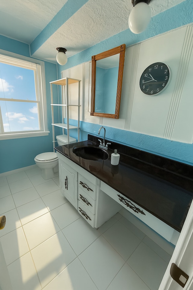 1531 N 24th Ave, Melrose Park, IL 60160 - half bath with tile patterned floors, vanity, and a textured ceiling