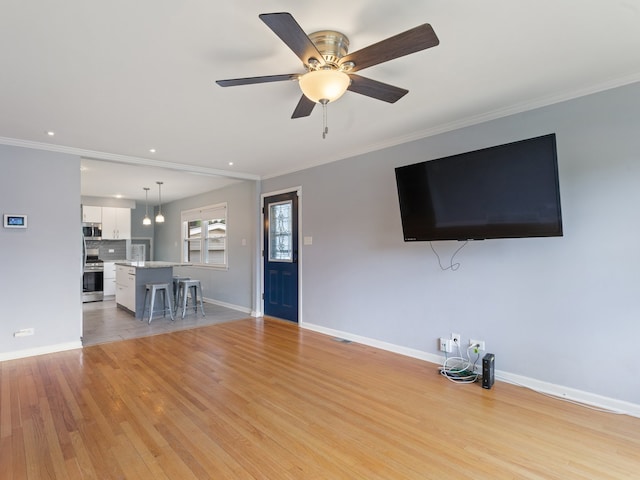 240 N Park Dr, Glenwood, IL 60425 - unfurnished living room with ornamental molding, light wood-type flooring, a ceiling fan, and recessed lighting