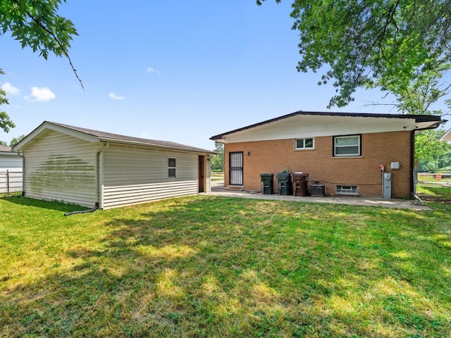 240 N Park Dr, Glenwood, IL 60425 - rear view of property with a patio and brick siding