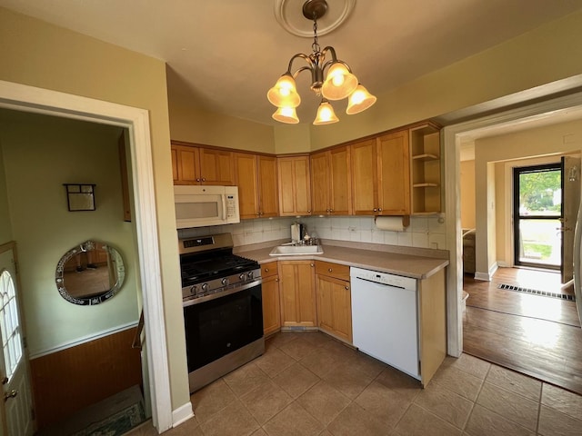 4225 Highland Ave, Downers Grove, IL 60515 - kitchen with white appliances, a chandelier, open shelves, tasteful backsplash, and light countertops