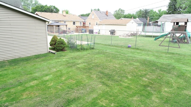 4225 Highland Ave, Downers Grove, IL 60515 - fenced backyard featuring a playground and a residential view