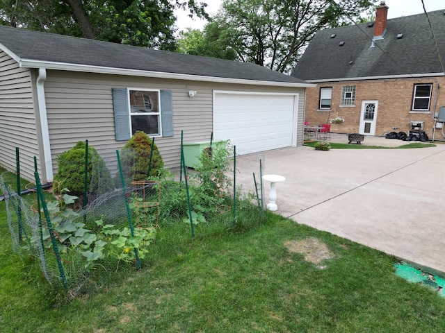 4225 Highland Ave, Downers Grove, IL 60515 - view of side of property featuring concrete driveway, an outdoor structure, roof with shingles, and a chimney