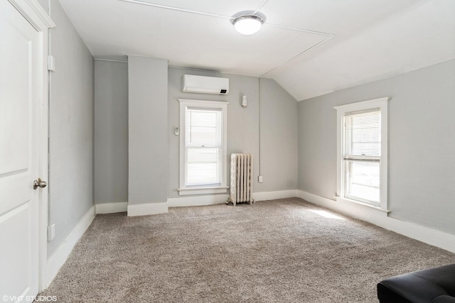 555 S Lasalle St, Aurora, IL 60505 - bonus room featuring radiator, a wall unit AC, lofted ceiling, and carpet