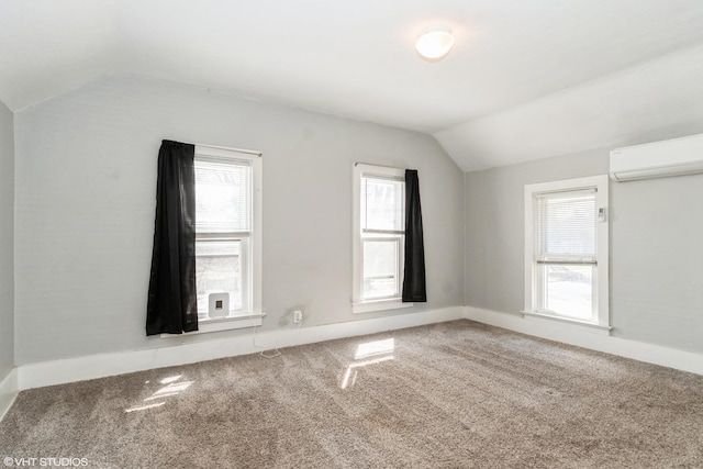 555 S Lasalle St, Aurora, IL 60505 - bonus room featuring a wall unit AC, lofted ceiling, and carpet flooring