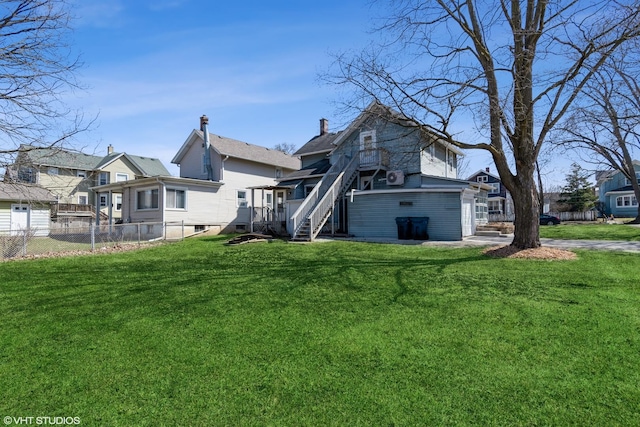555 S Lasalle St, Aurora, IL 60505 - rear view of house with stairway, a residential view, and a deck