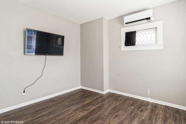555 S Lasalle St, Aurora, IL 60505 - spare room featuring a wall unit AC and wood finished floors