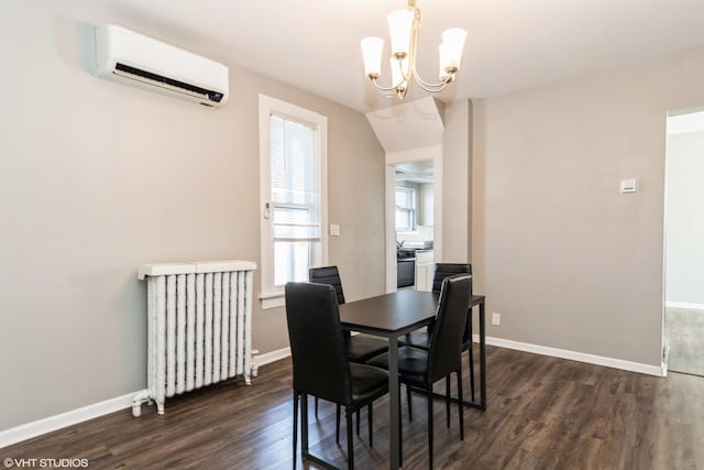 555 S Lasalle St, Aurora, IL 60505 - dining space with an AC wall unit, radiator heating unit, dark wood finished floors, and a chandelier